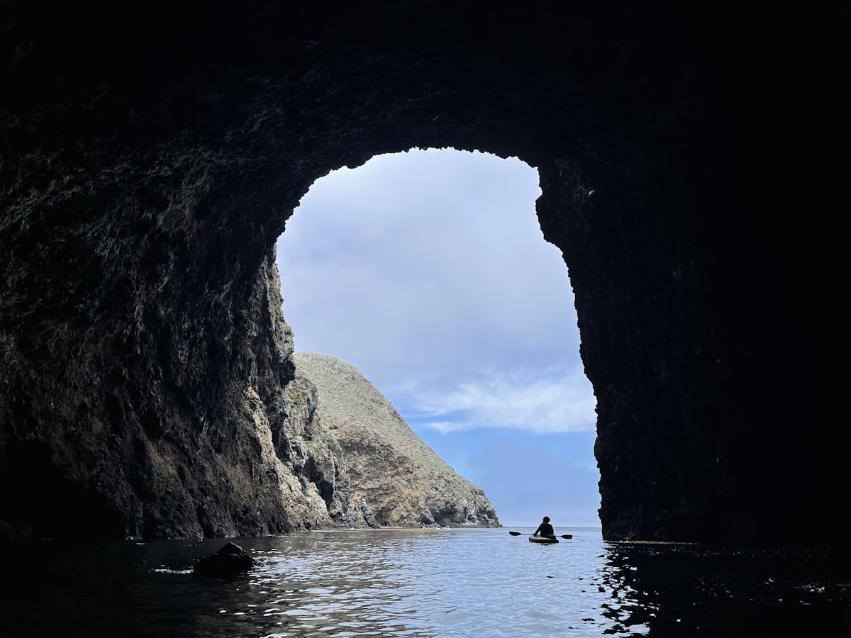 Kayak tour approaching sea caves